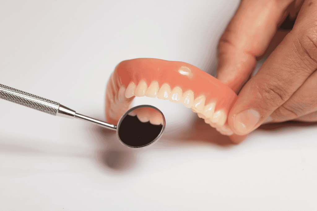 Comparing Traditional Dentures and Permanent Dentures: Benefits & Costs
